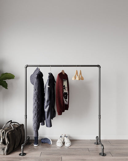 Portable and Collapsible Pipe Clothes Rail, a freestanding rack with hanging garments, highlighting its convenient and space-efficient design.