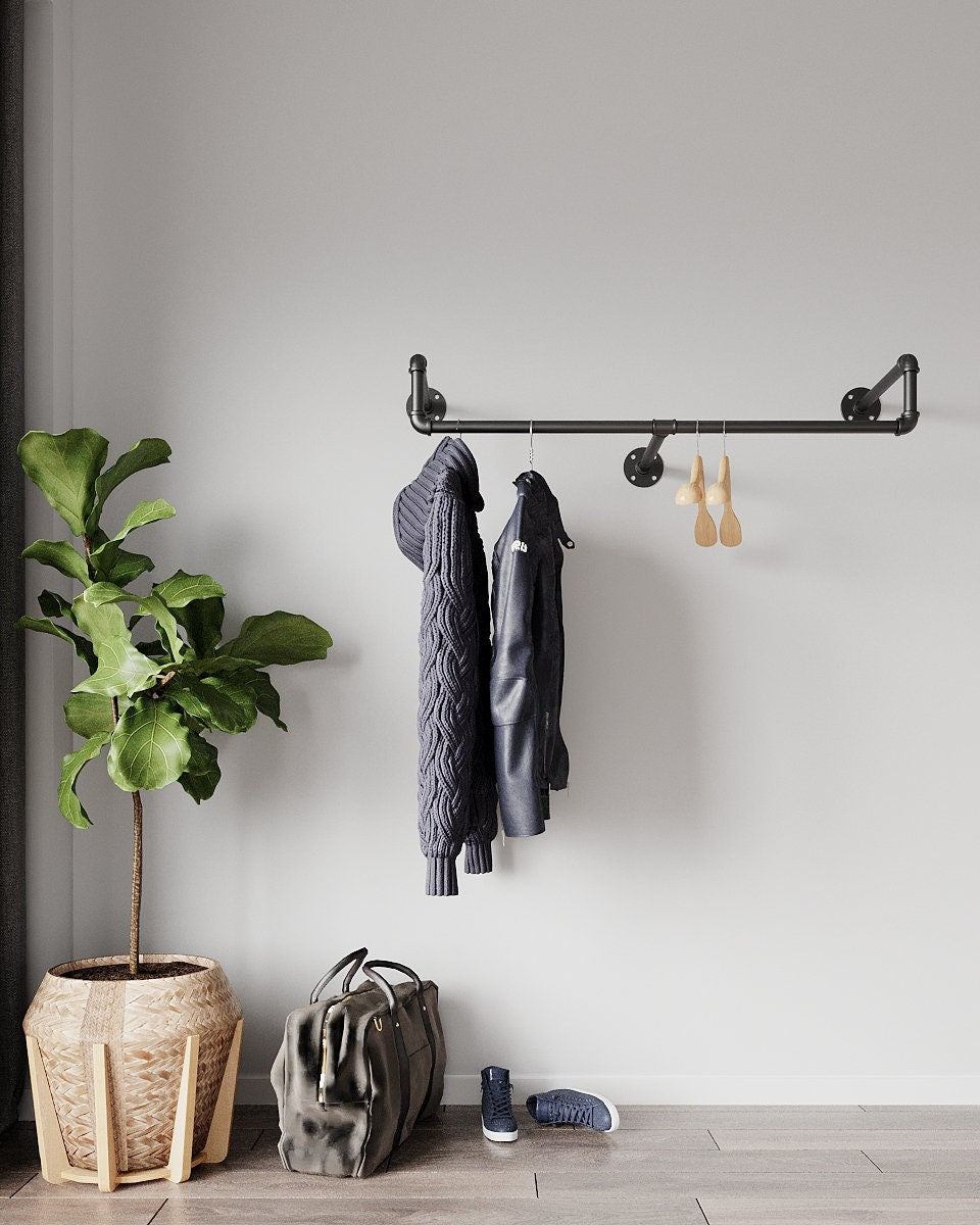 Wall-Mounted Clothes Rail with hanging garments