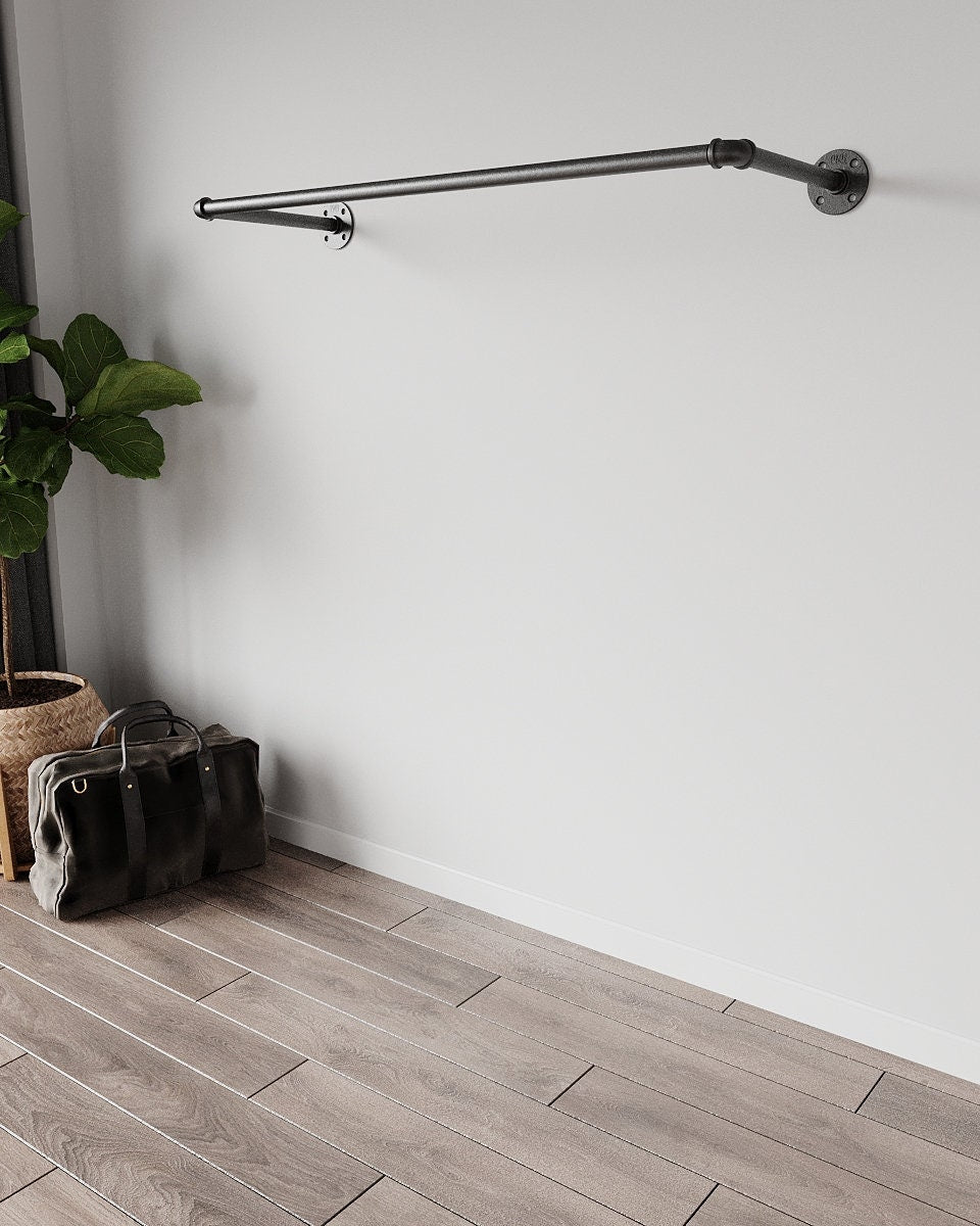 Industrial Pipe Wall Mounted Clothing Rack, a sleek and durable clothes rail and open wardrobe solution, suitable for various aesthetic settings.