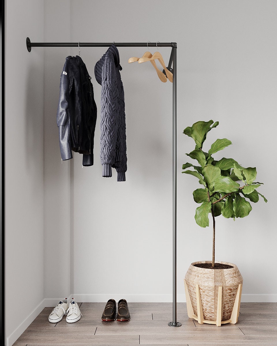 Livto Corner Clothes Rack, showcasing its heavy-duty pipe clothes rail and wall-mounted design.