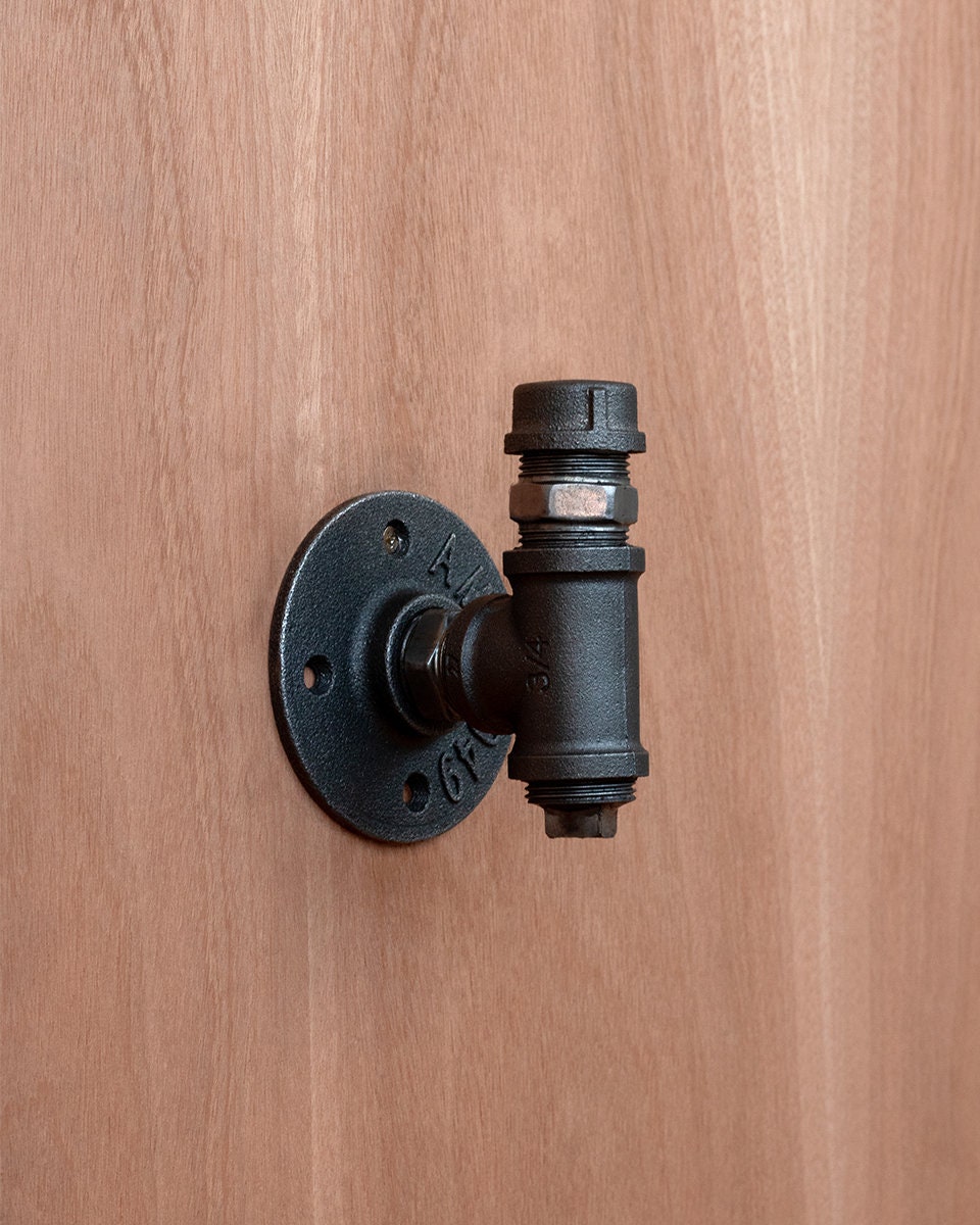 Sturdy Pipe Coat Hanger Clothes Hook with a rustic finish, perfect for hanging coats, hats, and scarves.