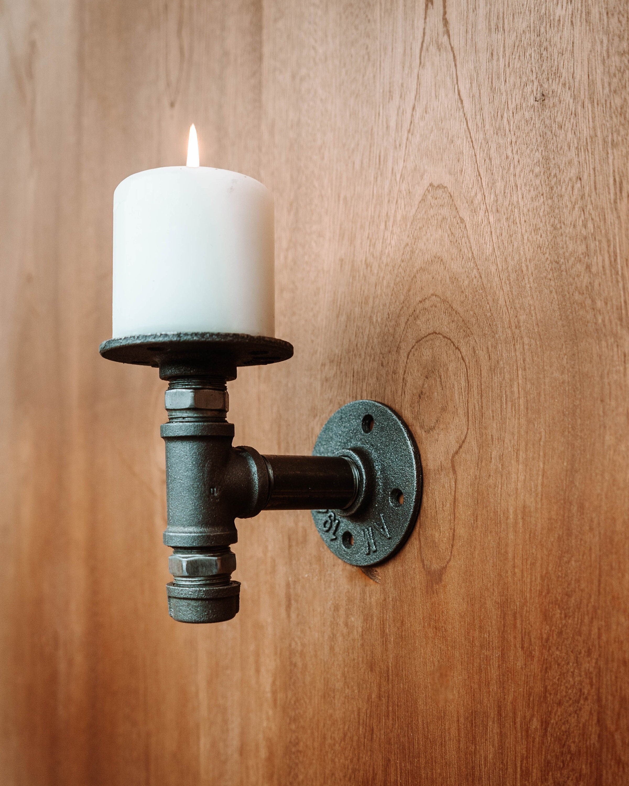 Wall Mounted Candle Holder with a candle plate, showcasing its elegant and sophisticated design.