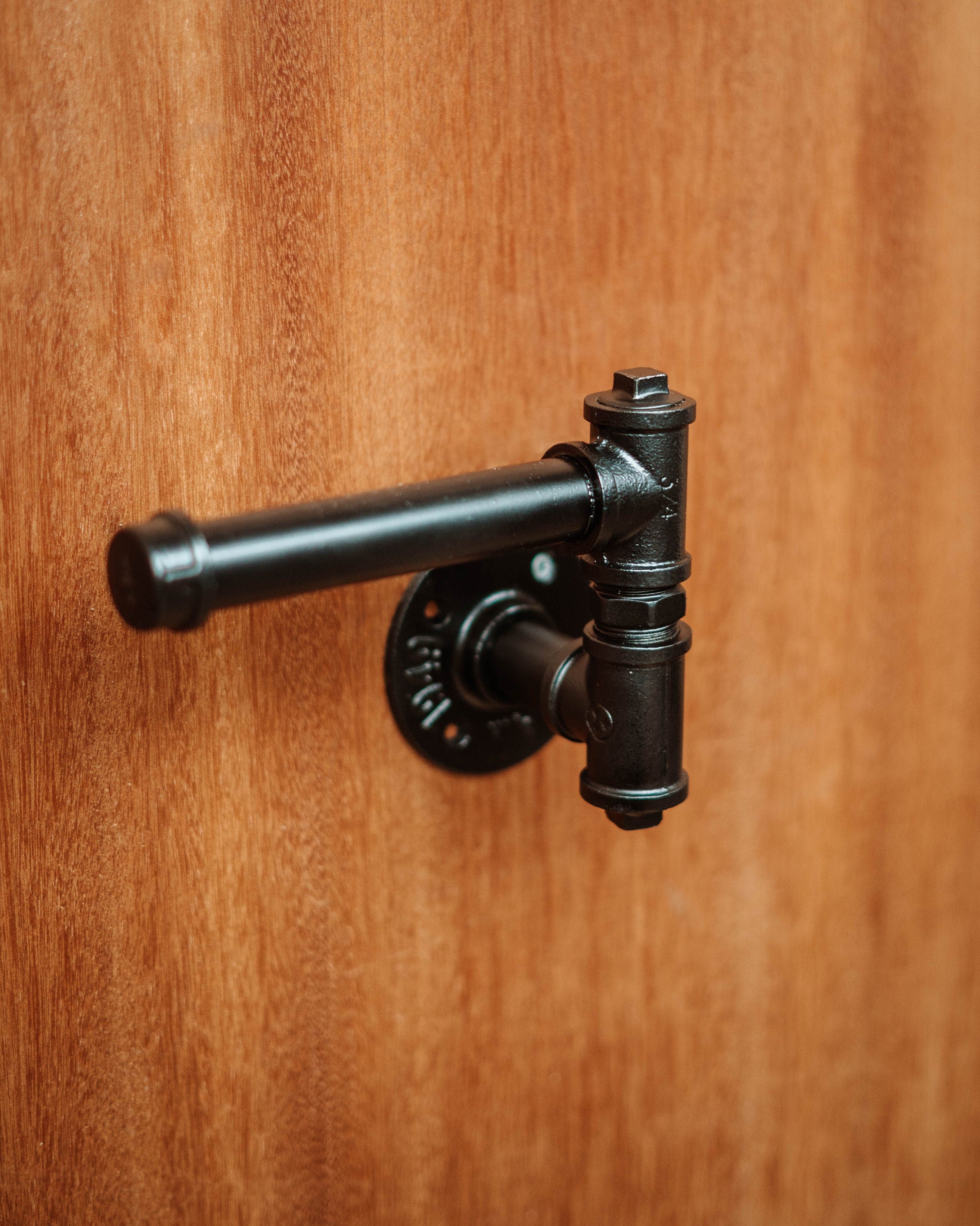 Modern Toilet Roll Holder supporting toiletroll, highlighting its practical and wall-mounted design