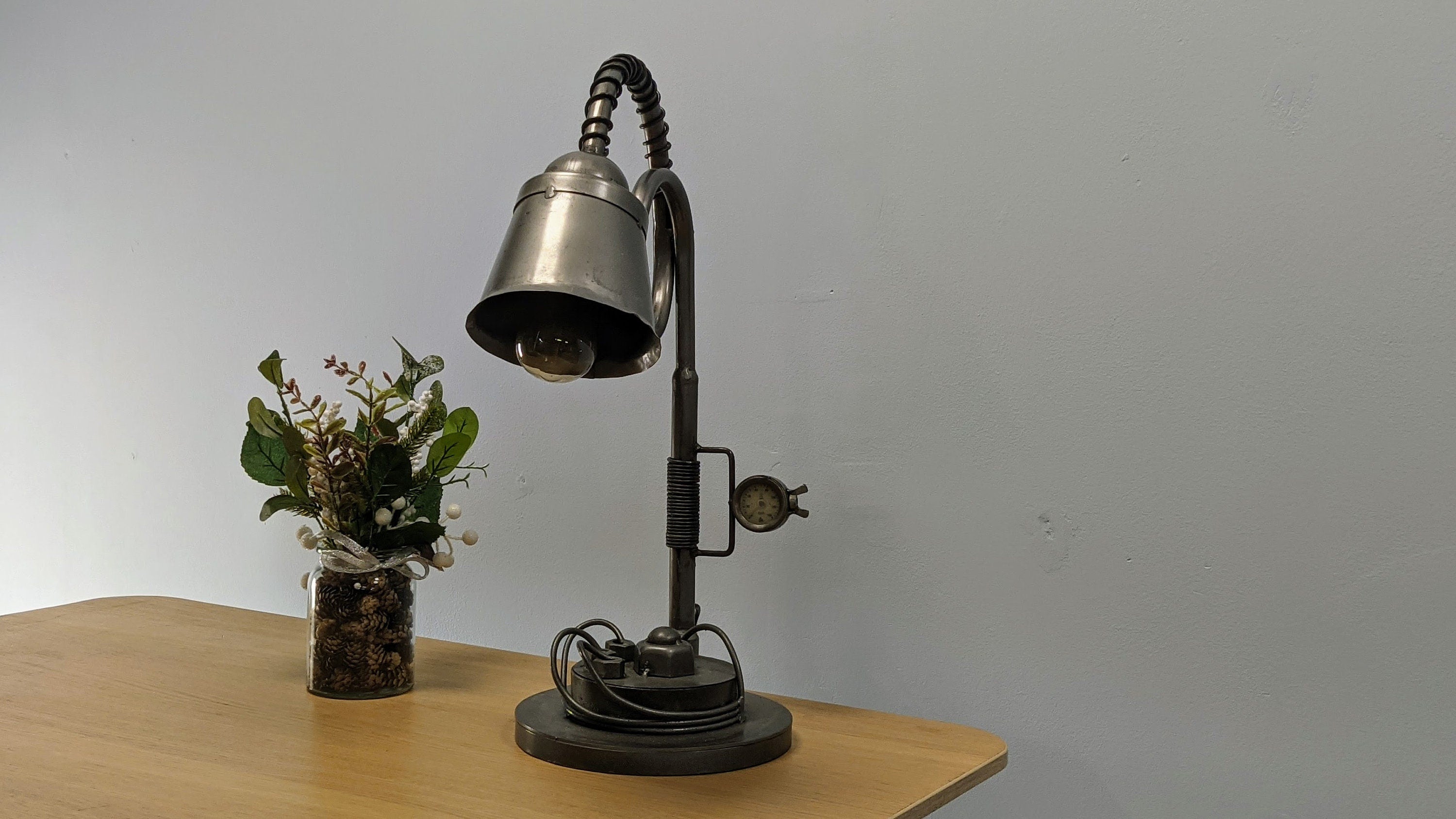 Stylish Side Table Lamp with industrial light design, perfect for enhancing room ambiance.