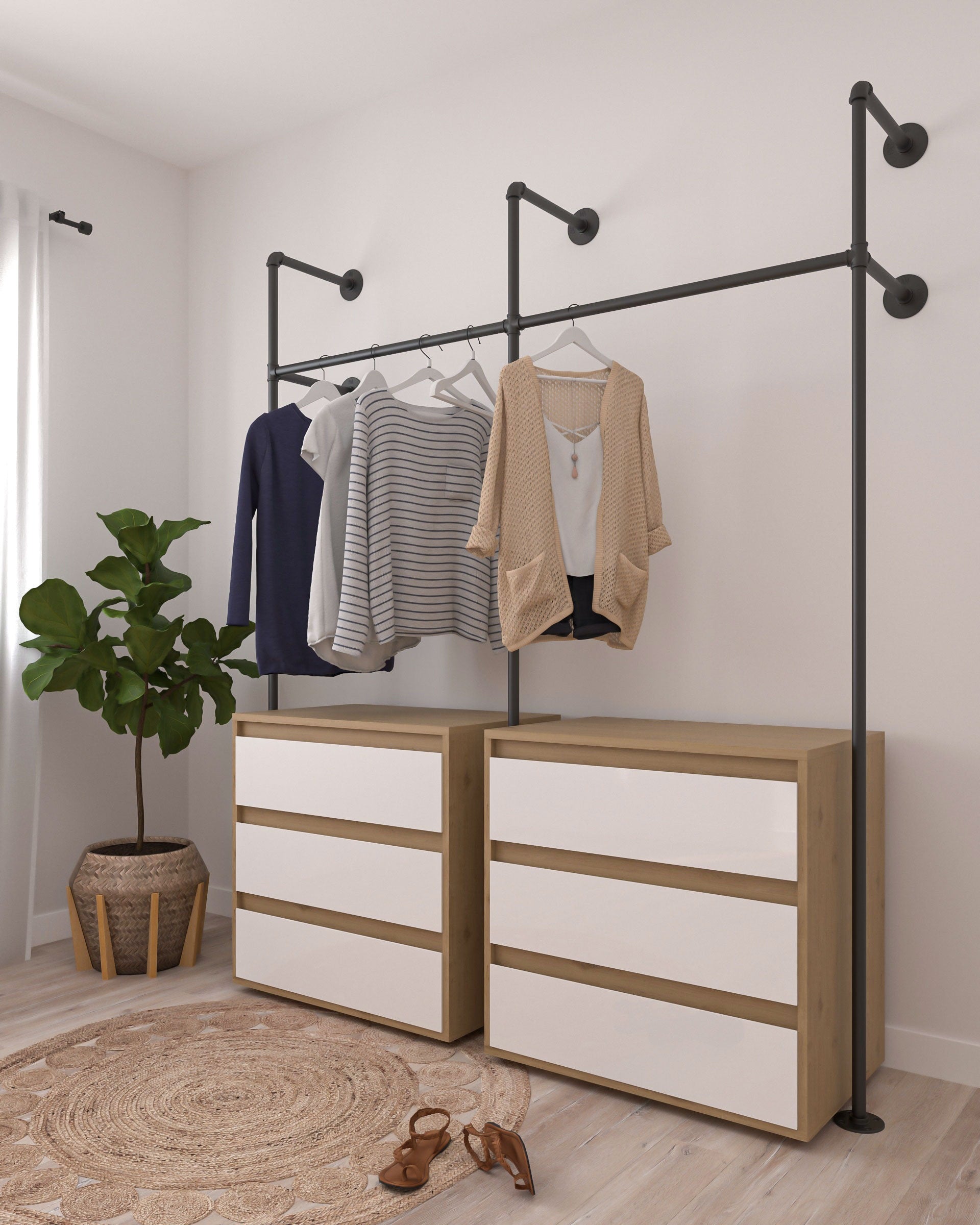 Glide Pipe Garment Rack wall-mounted, showcasing its industrial design and functionality for hanging clothing