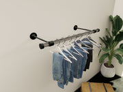 Customizable wall-mounted wardrobe organizer made from high-quality lucite and brass.