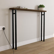 Wooden console table with black metal legs against a white wall.