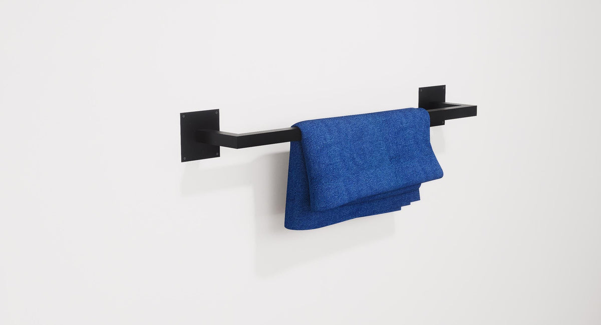 Minimalist square towel holder made from sturdy metal, featuring an industrial design. Ideal for organizing towels in the bathroom, adding a modern touch to decor. Durable and easy to install.