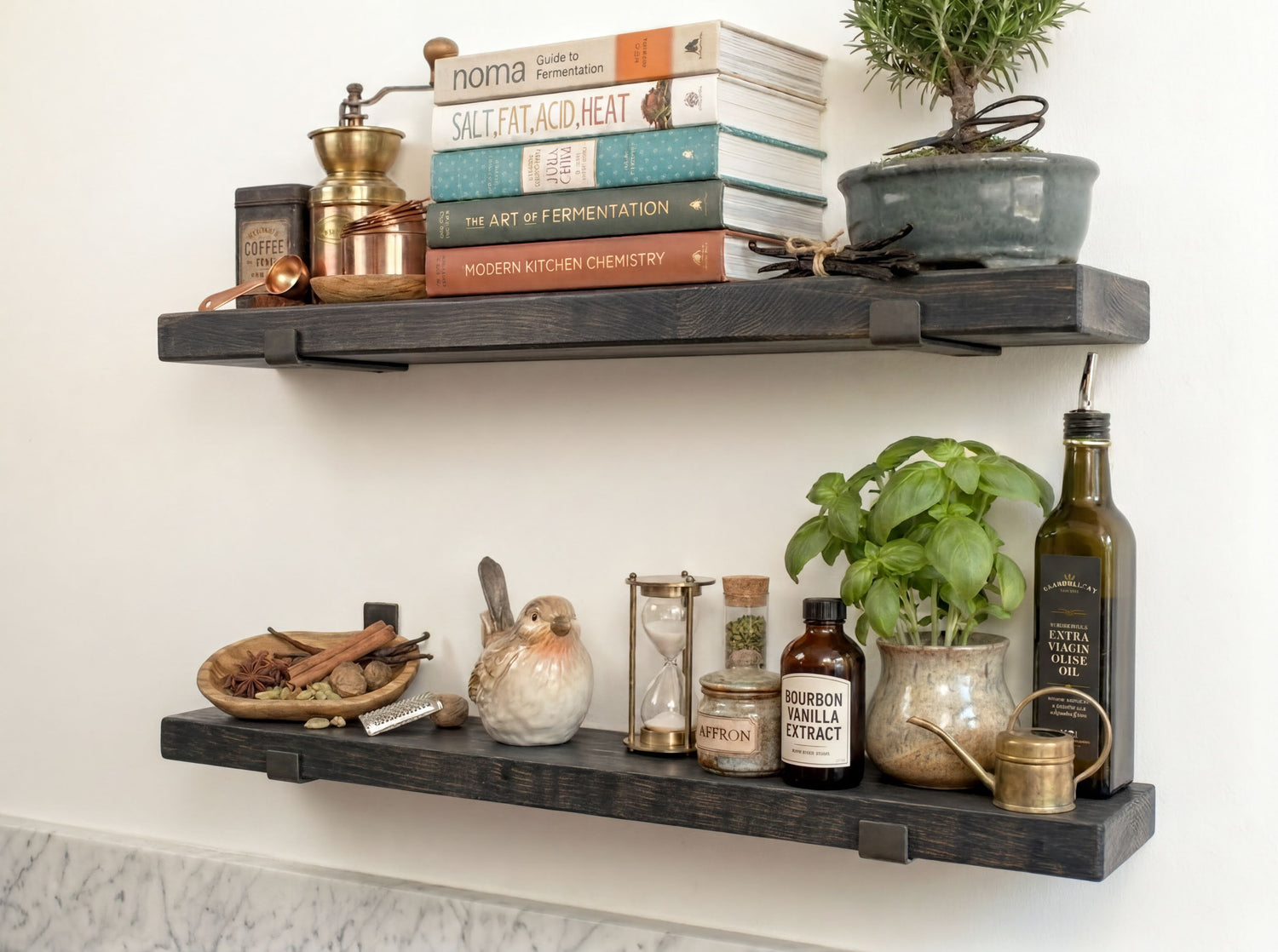 a set of dark wooden shelves displaying various items, including books, spices, a potted plant, and other decorative objects.