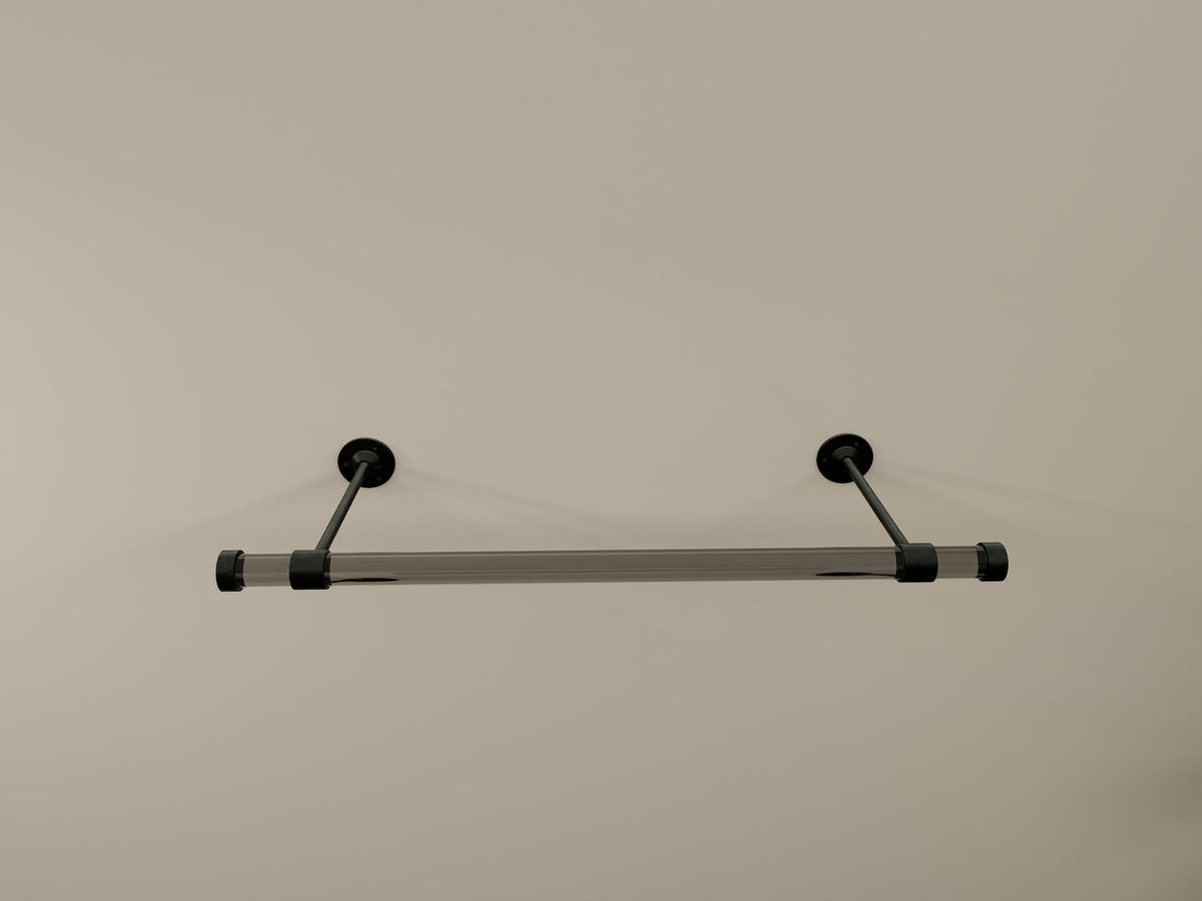 Customizable wall-mounted wardrobe organizer made from high-quality lucite and brass.