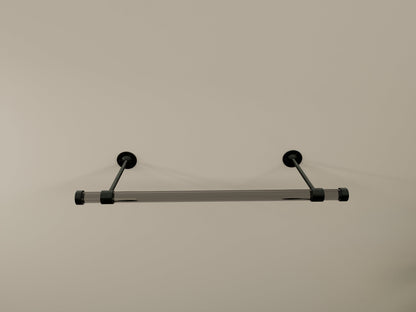 Customizable wall-mounted wardrobe organizer made from high-quality lucite and brass.