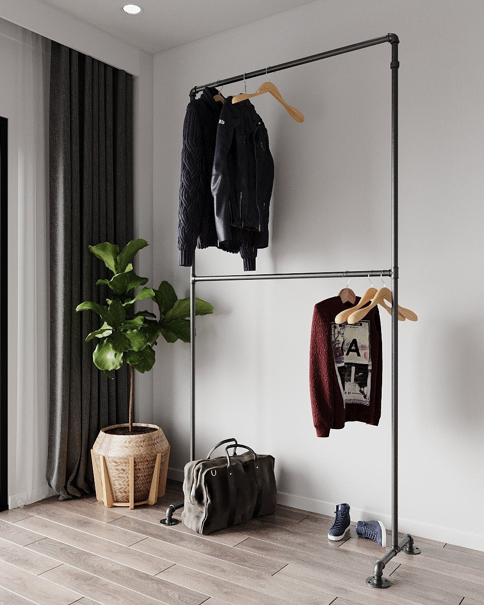 Artelos Freestanding Pipe Clothes Rack, a sturdy and vintage double clothes rack with two levels, suitable for hanging clothing and organizing accessories.