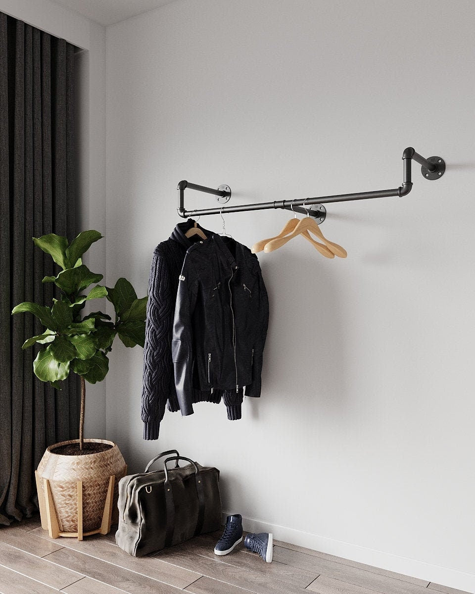 Wall-Mounted Clothes Rail with hanging garments