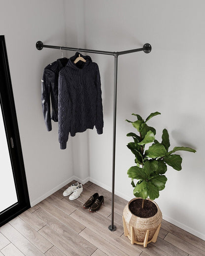 Livto Corner Clothes Rack, showcasing its heavy-duty pipe clothes rail and wall-mounted design.