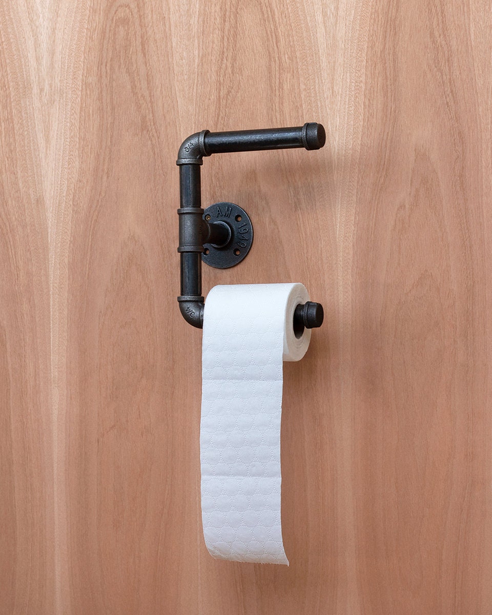 Toilet Roll Holder mounted on the wall, showcasing its sleek and practical design.