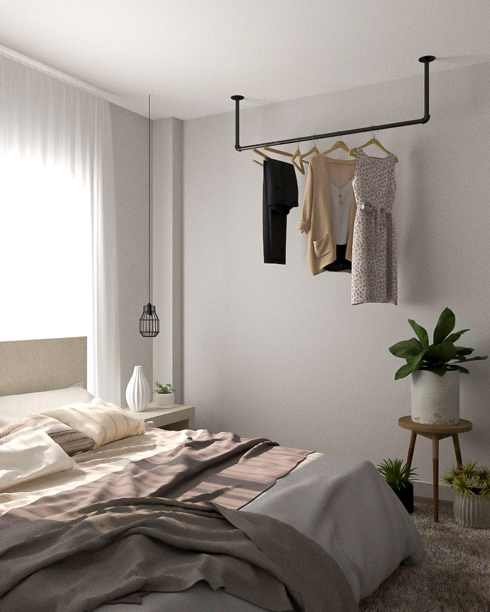 Durga Clothes Rail, a heavy-duty pipe ceiling mounted clothes rack, suitable for hanging and organizing 