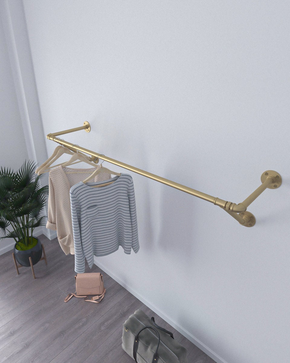 Golden Wall Mounted Clothes Rack, an elegant clothes rail and open wardrobe solution, suitable for commercial and home clothes storage.