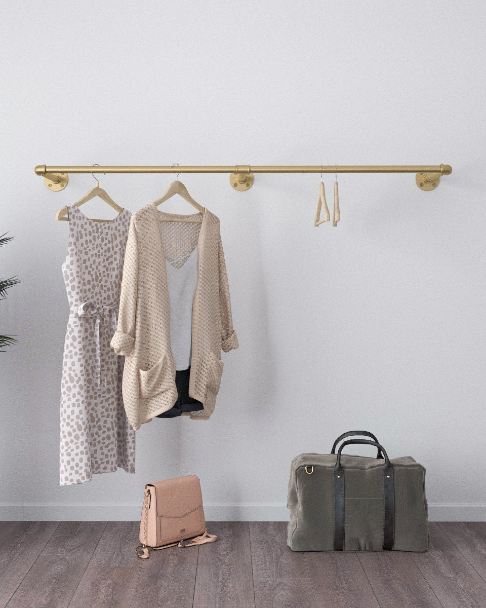 Arvuy Golden Wall Mounted Clothes Rack, an elegant and adjustable clothes rack with a golden finish, suitable for home organization or retail display