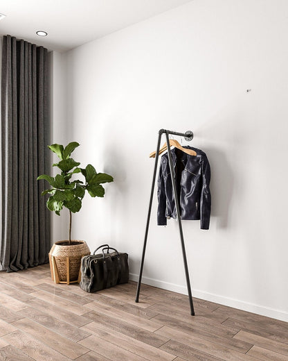 Iblu Clothes Rail, a wall-mounted and floor-supported industrial pipe clothes rail, showcasing its heavy-duty design.&quot;