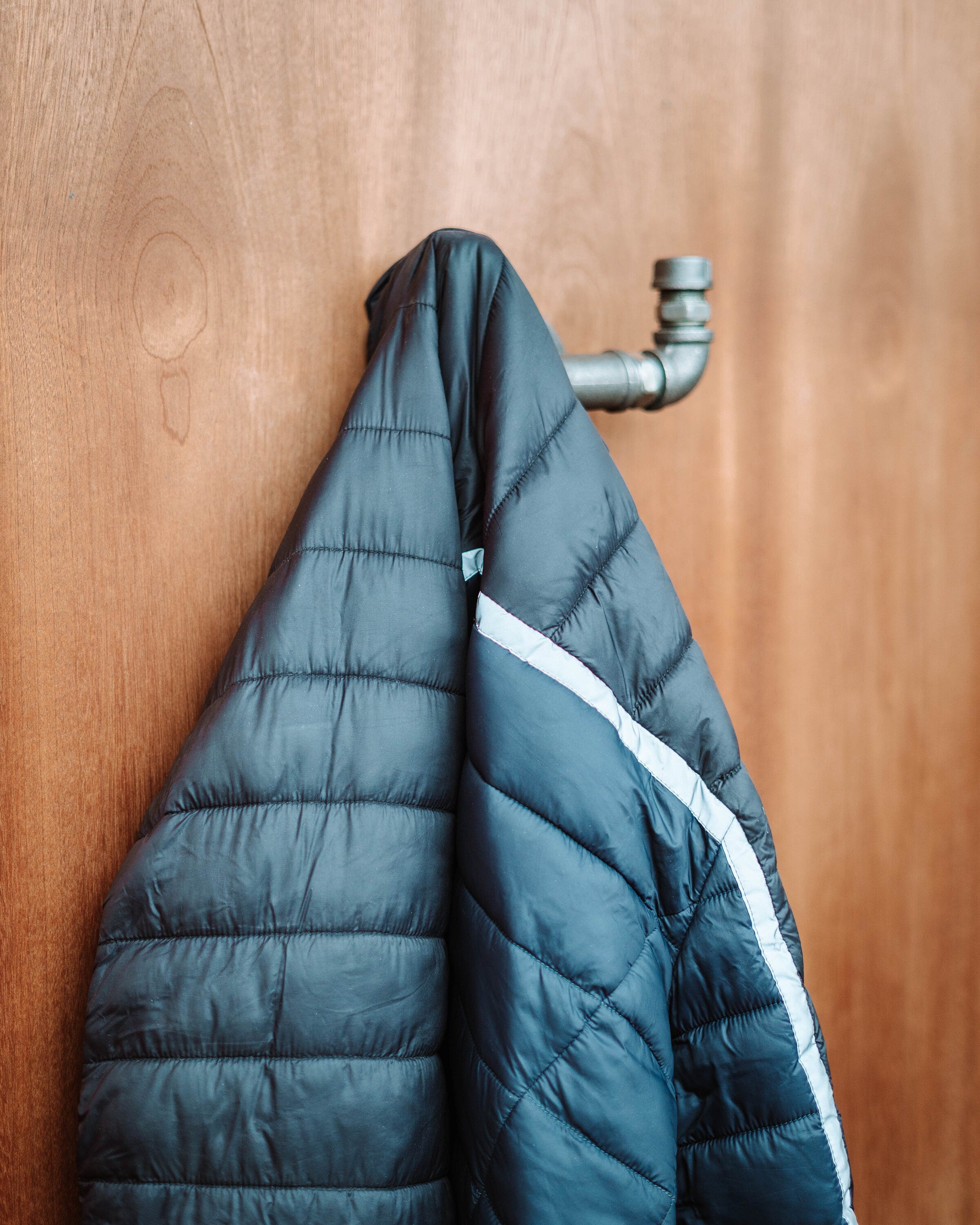 Industrial-style Pipe Coat Hanger Clothes Hook, ideal for organizing coats and accessories.