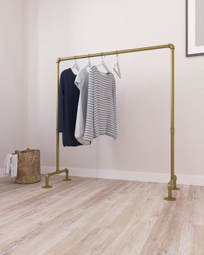 versatile Freestanding Pipe Clothes Rack made of gold rustic iron, filled with organized garments, showcasing its sturdy and unique design